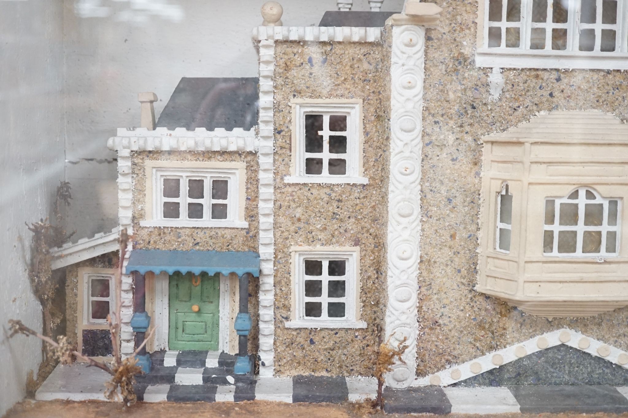 A diorama of a country house, case 63 cm wide